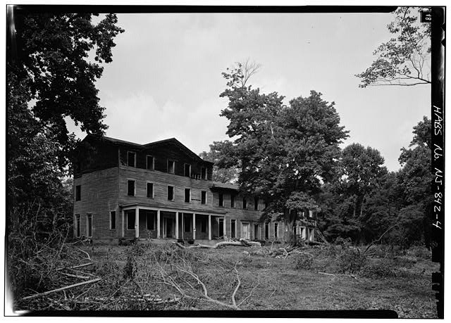 Exterior view of the main residential edifice of the North American Phalanx. This government photo was taken shortly before the building burned to the ground in November 1972.  Photographed by the US National Park Service Historic American Buildings Survey (HABS/HAER/HALS). Public Domain