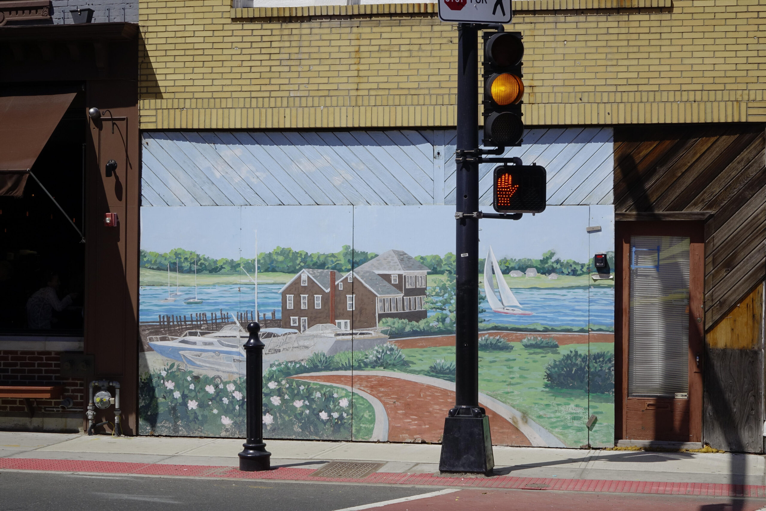 Image of mural depicting Monmouth Boat Club from above and behind; mural location and artist unknown; photographer: Joel Zatz.