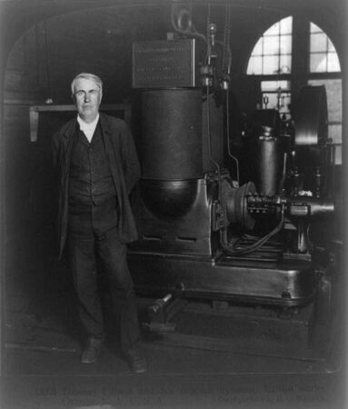 Thomas Edison and his original dynamo, Edison Works, Orange, N.J. b&w film copy neg. of half stereo by H.C. White Co., created / published c1906. Library of Congress image, public domain.