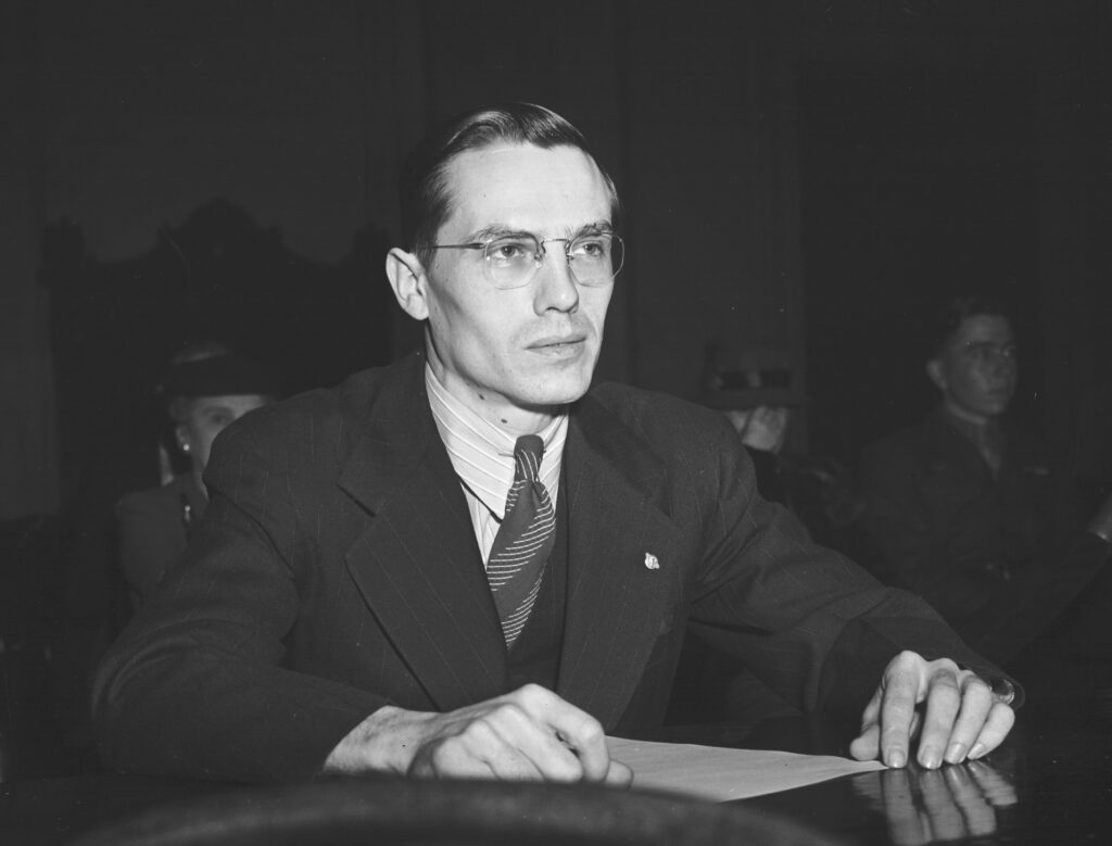 Photo of George E. Elliott Jr. preparing to testify at a Congressional hearing about Pearl Harbor on Feb. 20, 1946. Elliott, whose unheeded warning about aircraft approaching Pearl Harbor was depicted in history books and movies like ``Tora, Tora, Tora,'' died Saturday, Dec. 20, 2003. He was 85. (AP Photo)