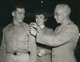 Photo of Joe Lockard receiving his lieutenant's bars at Fort Monmouth. U.S. Army Signal Corps Archives, public domain.