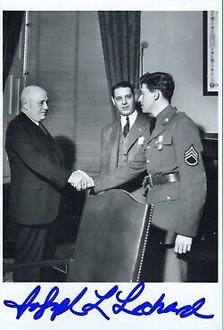 A photo, autographed by Joe Lockard, showing him receiving his Distinguished Service Medal. U.S. Army Signal Corps Archives, public domain.
