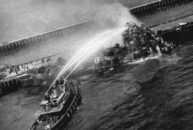 Photo: A fireboat tries to put out the fires aboard the U.S. Navy destroyer escort USS Solar (DE-221) at the Naval Ammunition Depot Earle, 30 April 1946.