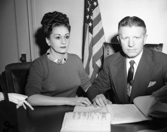 Mrs. Anna Genovese goes over documents with her attorney Osie M. Silber somewhere in N.J., in March 1953. (AP Photo)