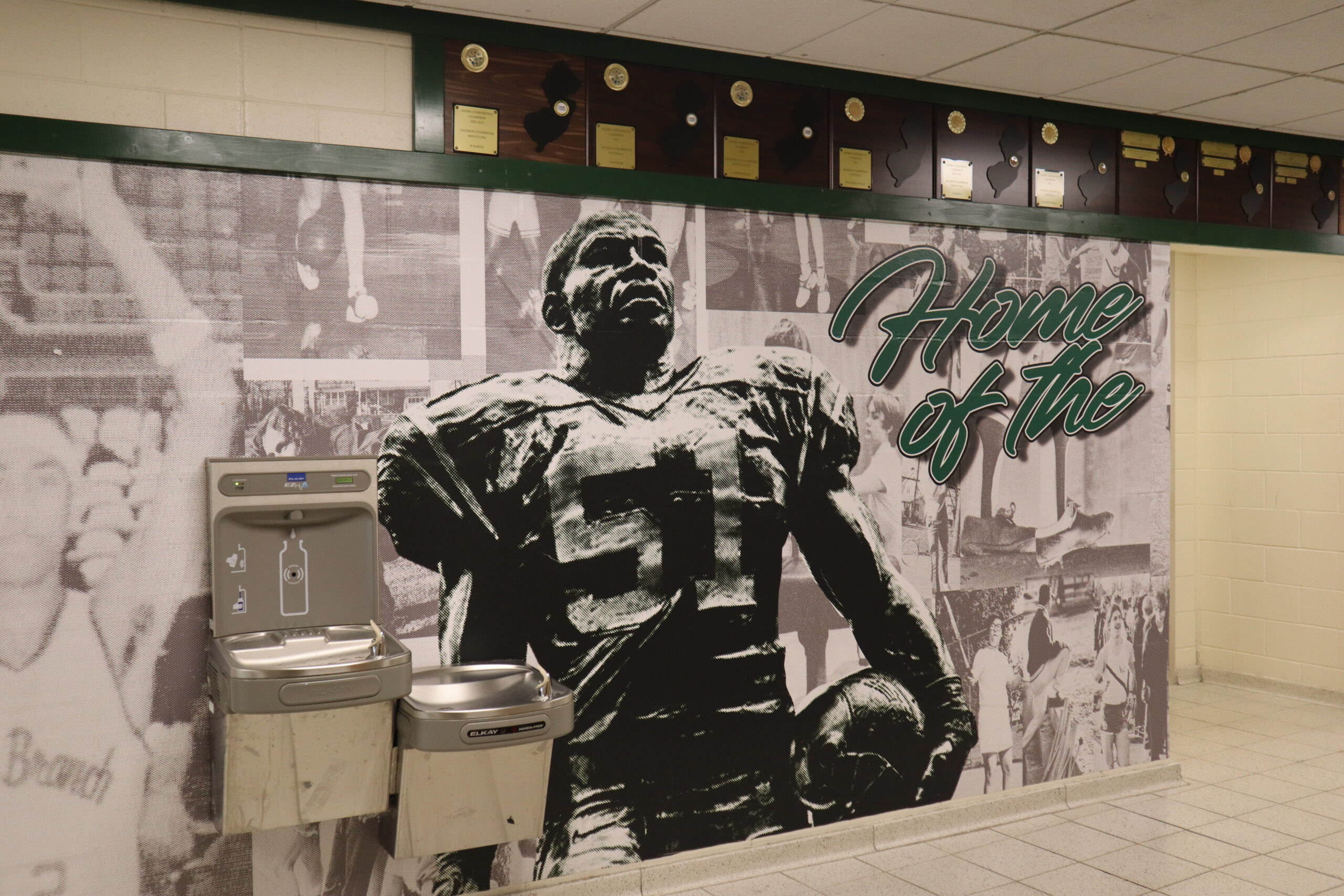 Sam Mills is featured on a mural on the walls of the Long Branch High School athletic facility, adjacent to the football stadium where Mills was a star for the Green Wave. Photo by John R. Barrows.