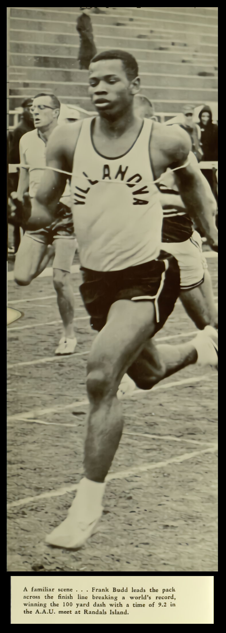 Image: Photograph of Frank Budd setting world record. Caption:   A familiar scene...Frank Budd leads the pack across the finish line breaking a world's record, winning the 100 yard dash with a time of 9.2 in the A.A.U. meet at Randals Island.   Image from The Belle Air 1962, Villanova University Yearbook. Image © Digital Library@Villanova University.