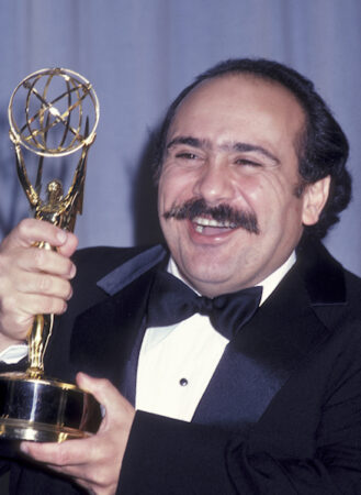 Danny DeVito holds his Emmy award.  Cropped screen capture from broadcast of Emmy awards, www.emmys.com. Consistent with Fair Use Doctrine. 