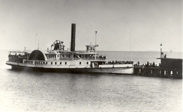 Photo of Sidewheeler River Queen, at the wharf. Public Domain.