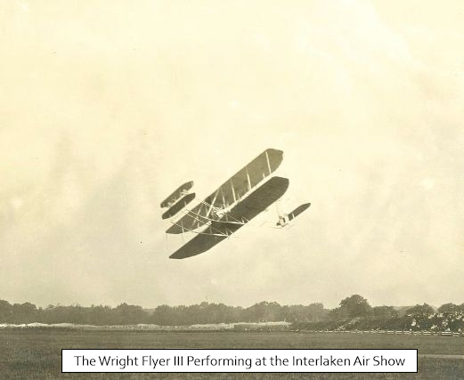 Photo of the Wright Brothers' airplane in flight at the 1910 air show in Interlaken.